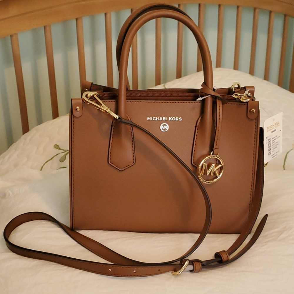 Brand New. Never used. Michael Kors Purse.